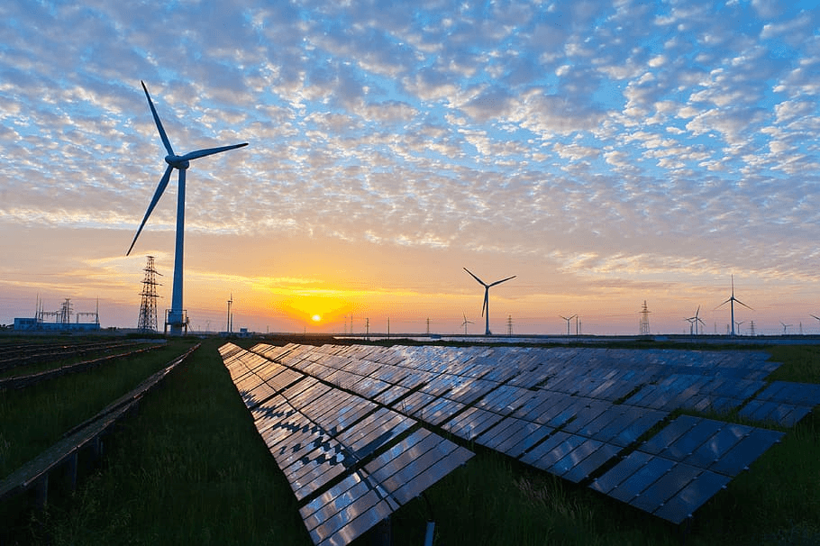 Renewable energy field with wind turbines and solar panels